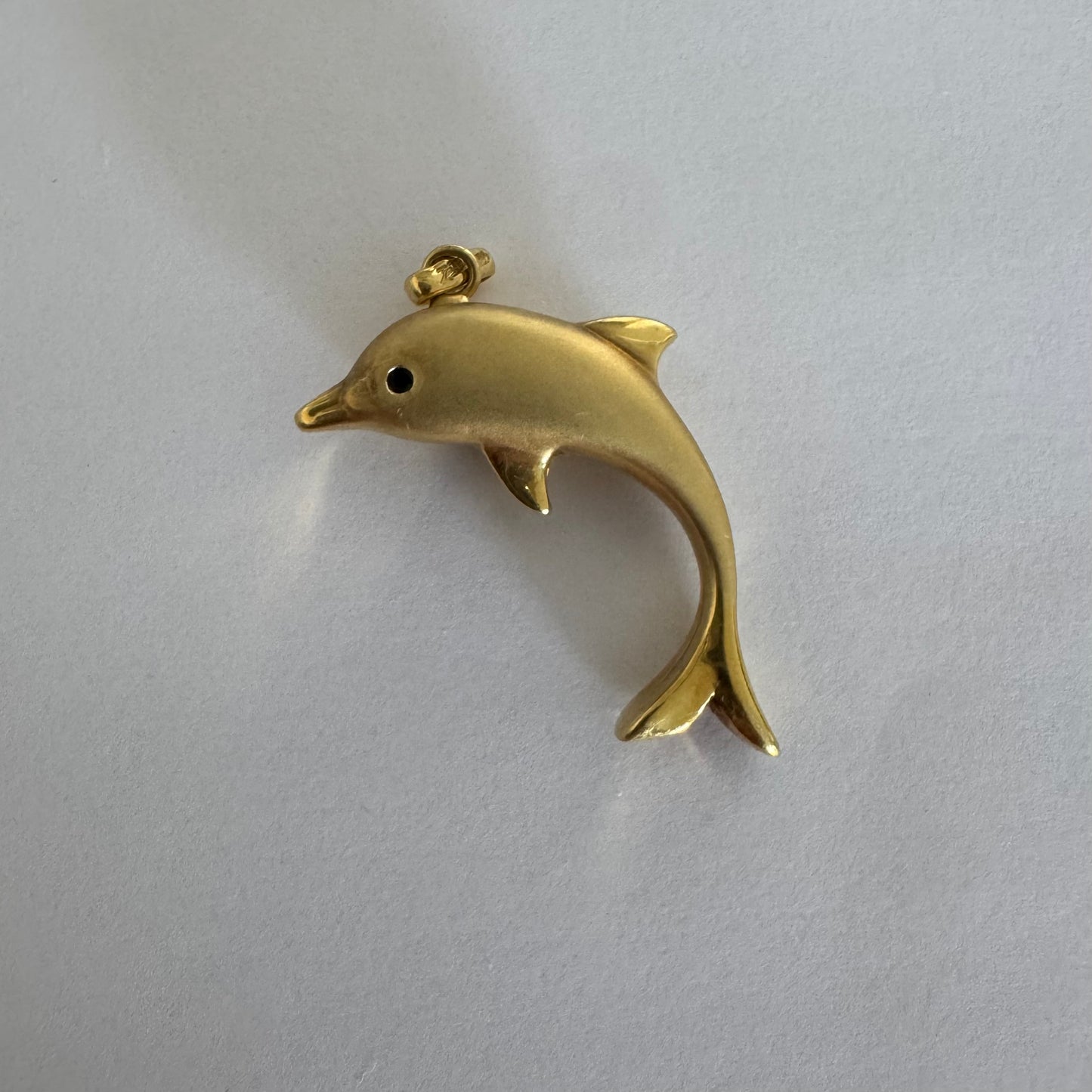 14K gold dolphin pendant with a smooth & polished finish.