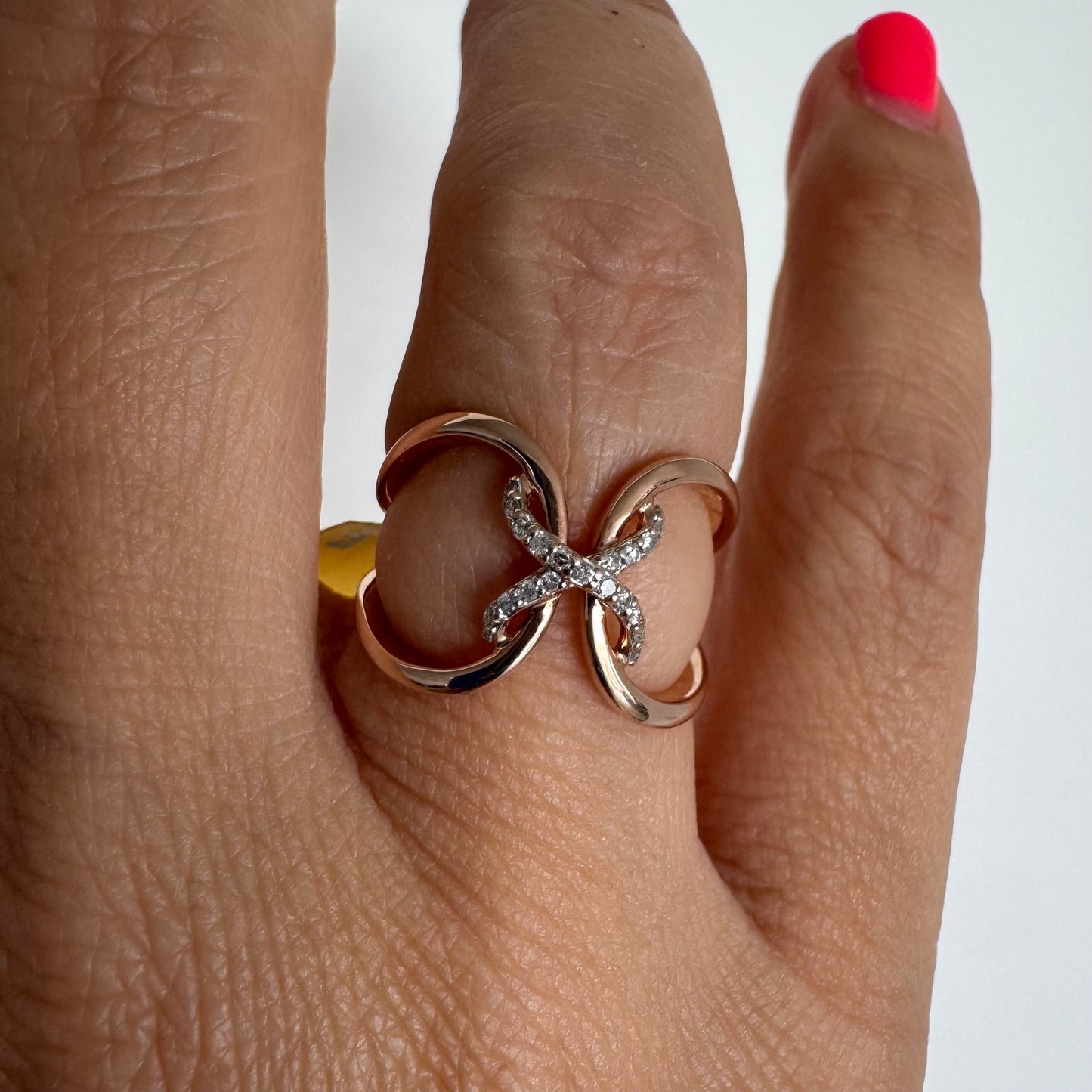 10K rose gold ring set with natural Diamonds in a flowing & artistic design.