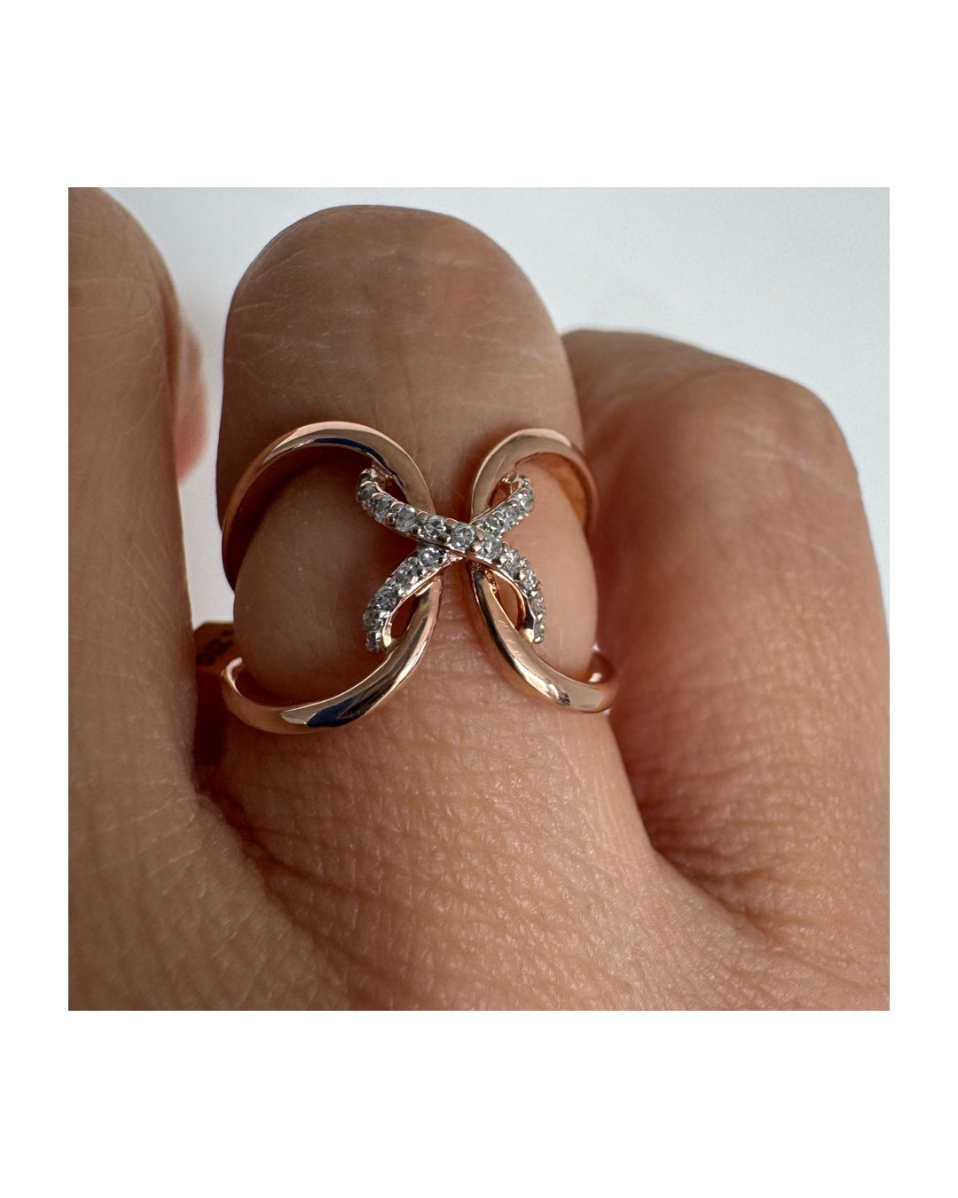 10K rose gold ring set with natural Diamonds in a flowing & artistic design.
