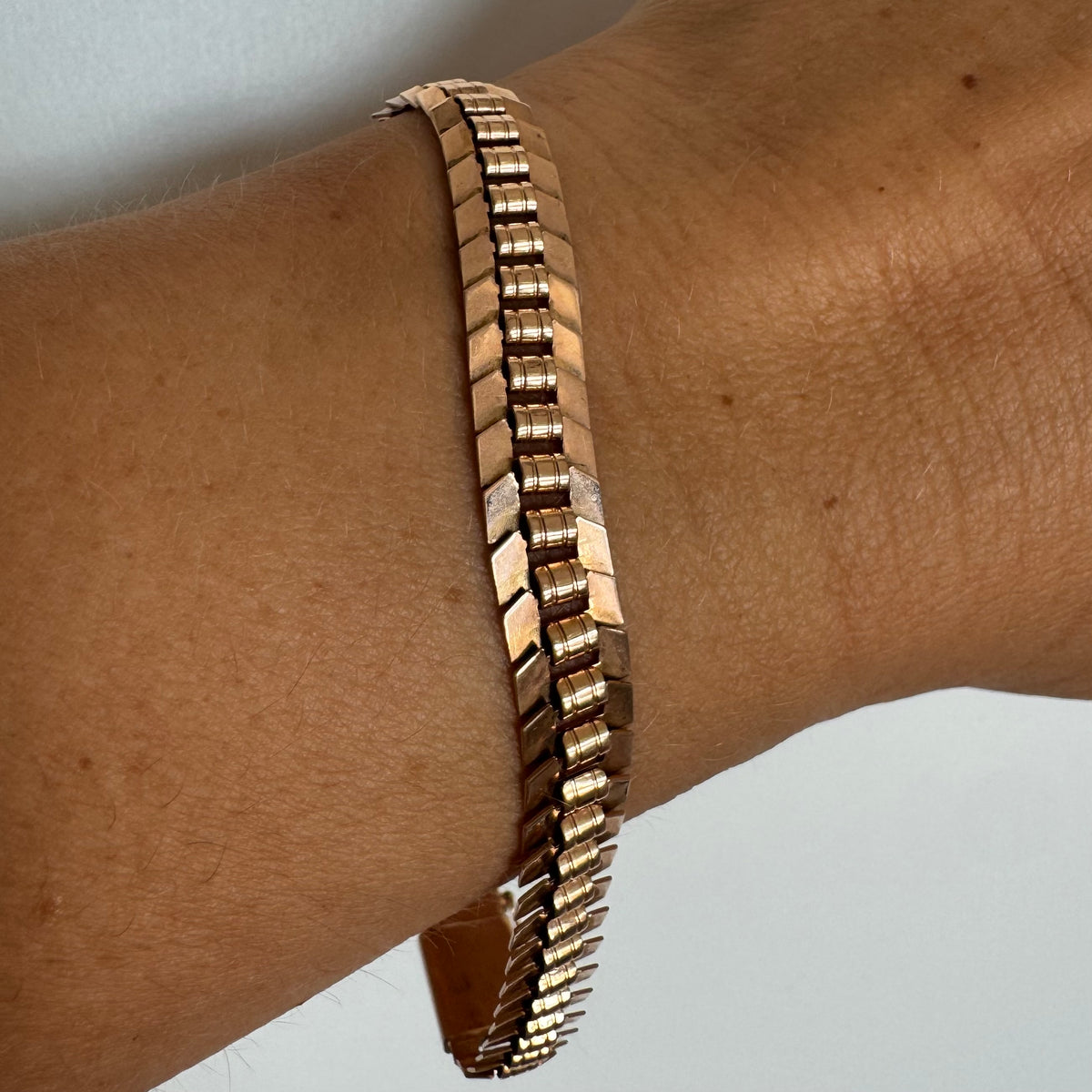 14K gold bracelet with a bold, flexible link design and a secure box clasp.