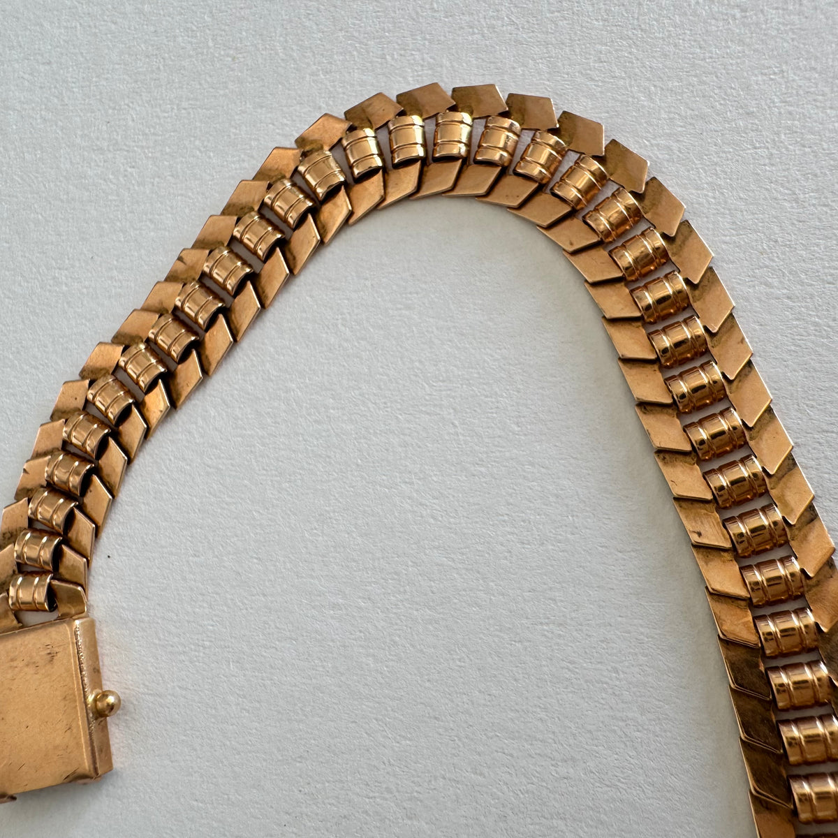 14K gold bracelet with a bold, flexible link design and a secure box clasp.