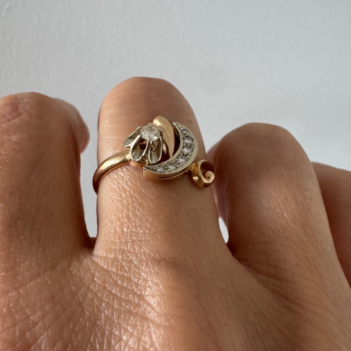 14K gold ring with a delicate moon and star motif set with Diamonds