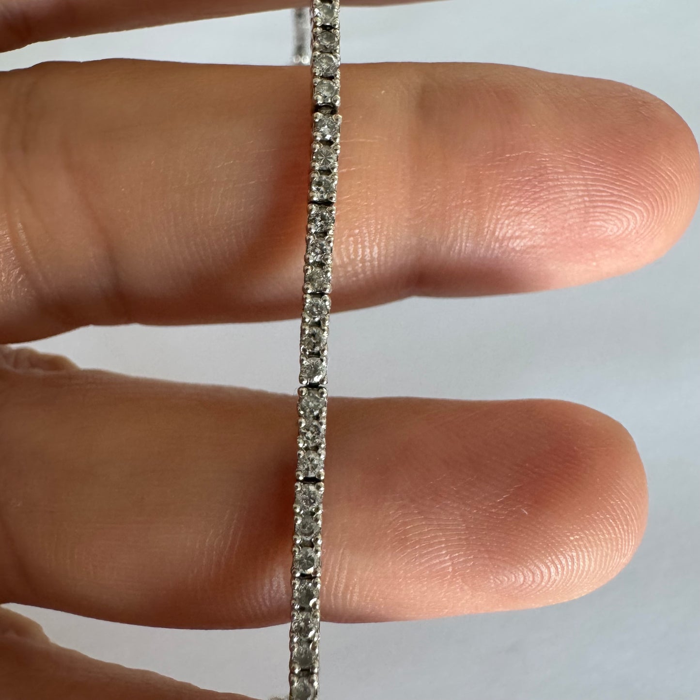 14K gold diamond bracelet with a sleek & elegant design.