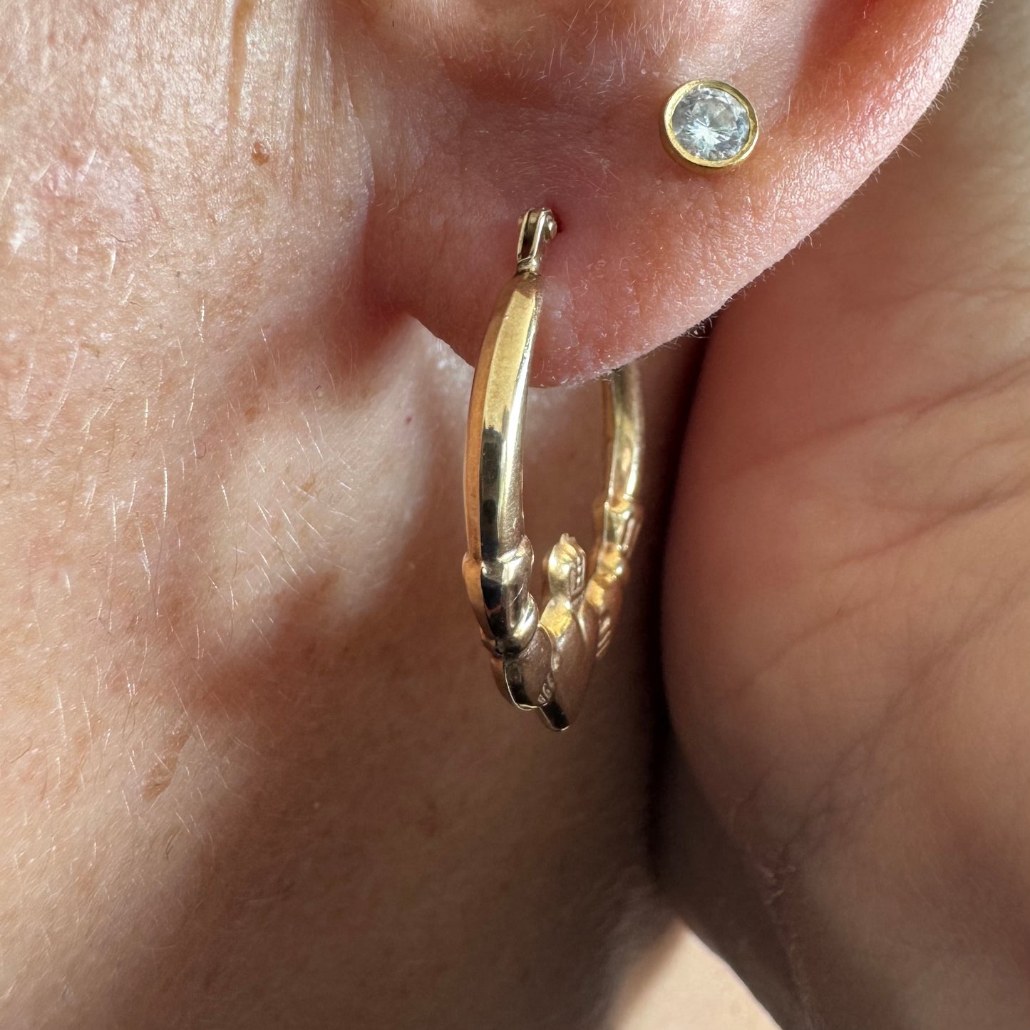 9K gold Claddagh earrings, featuring the iconic Irish motif of a heart held by two hands and topped with a crown, traditionally symbolizing love, friendship and loyalty.
