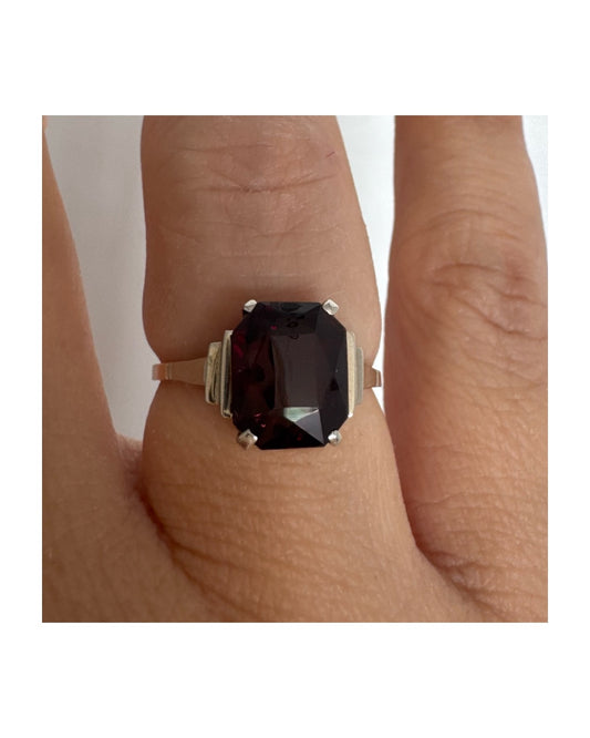 9K gold ring set with a deep burgundy Garnet in an elegant square cut.