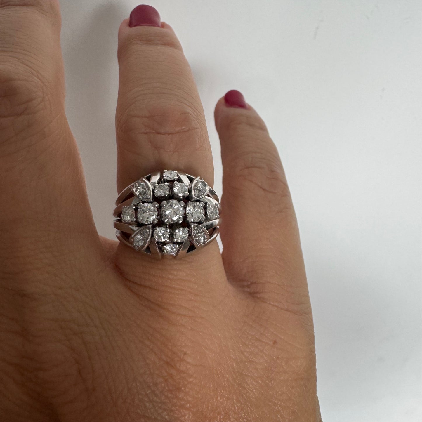 Platinum ring set with Diamonds in a bold, multi-layered floral design.