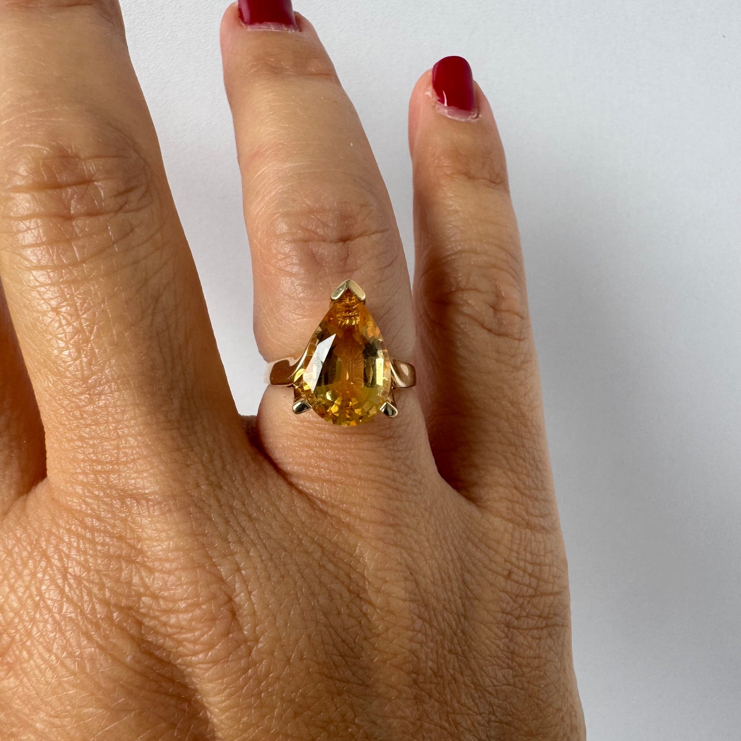 14K gold ring set with a large pear-shaped Citrine
