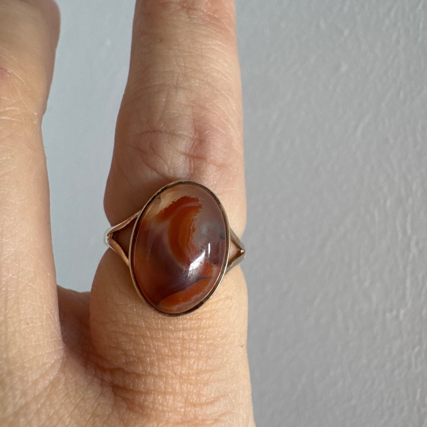 9K gold ring set with a warm reddish-brown stone featuring beautiful natural patterns