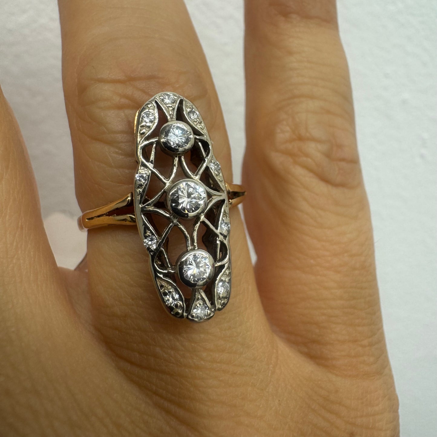 14K gold ring set with diamonds in an elongated openwork design