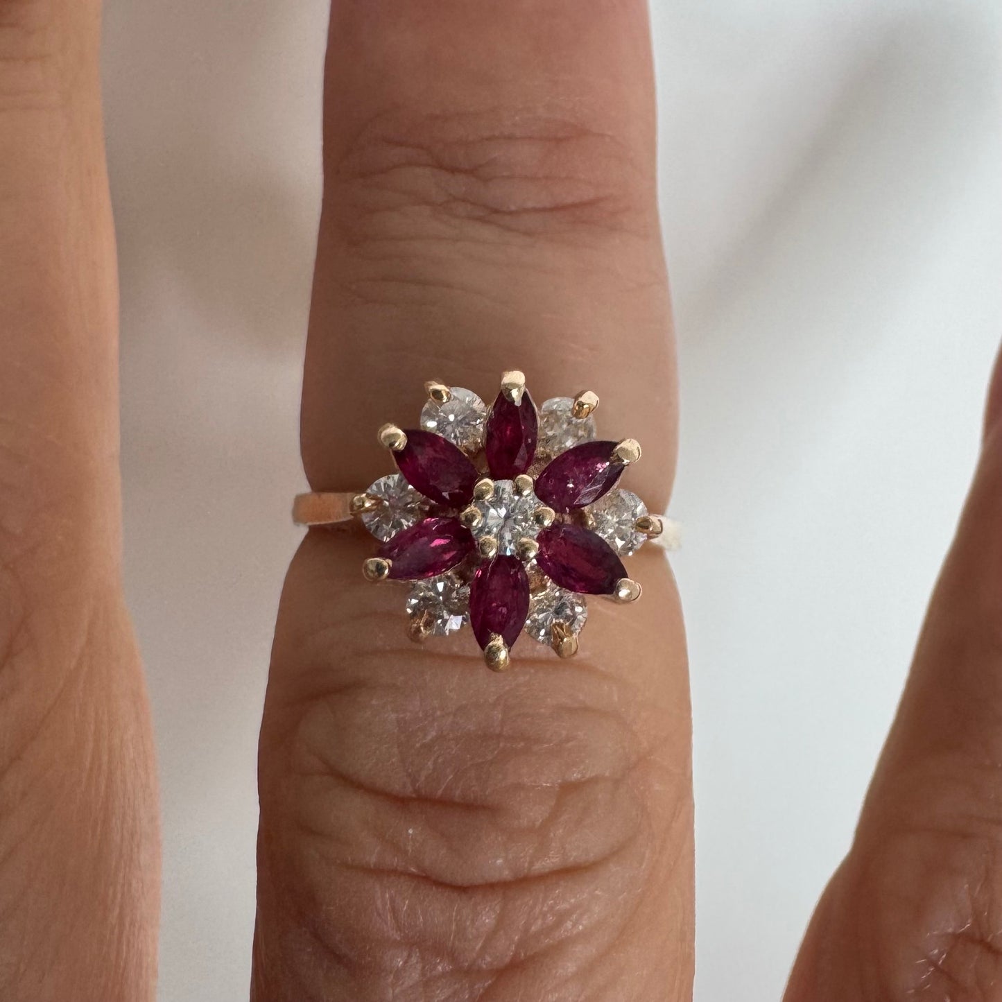 14K gold ring featuring a classic floral-inspired design set with marquise-cut Rubies & Diamonds.