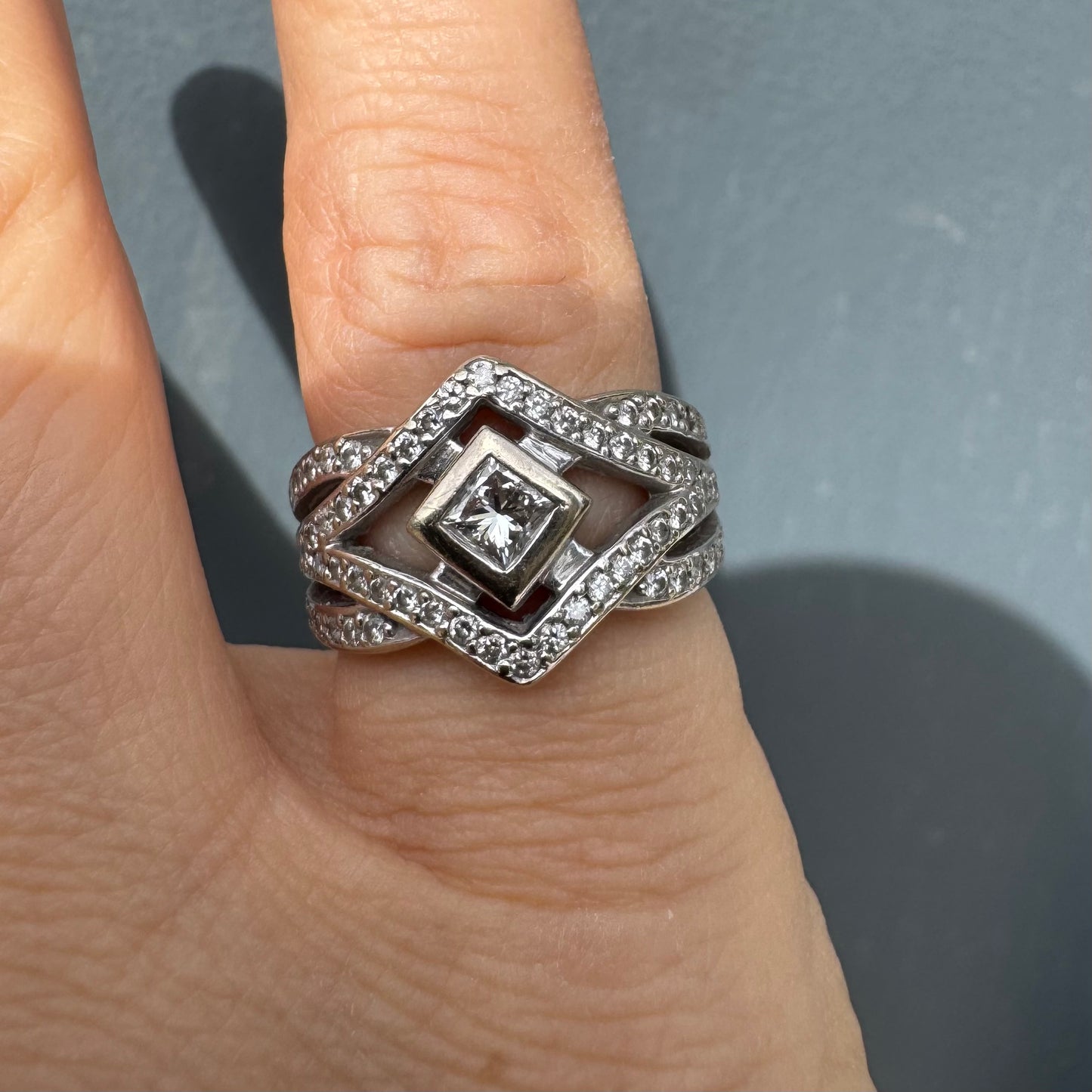 14K gold diamond ring featuring a luxurious geometric Art-Deco inspired design.