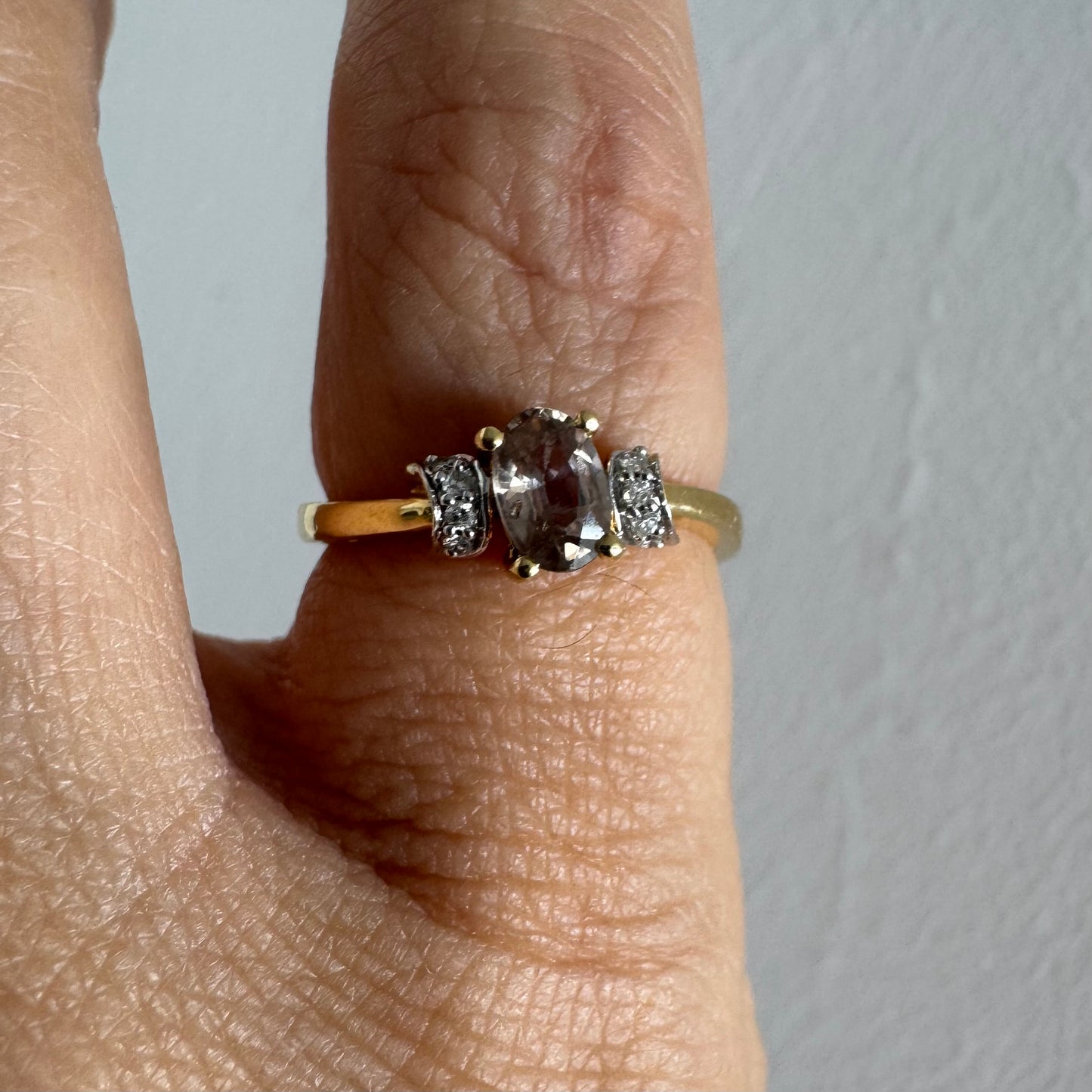 18K gold ring featuring a captivating oval Smoky Quartz & side Diamonds