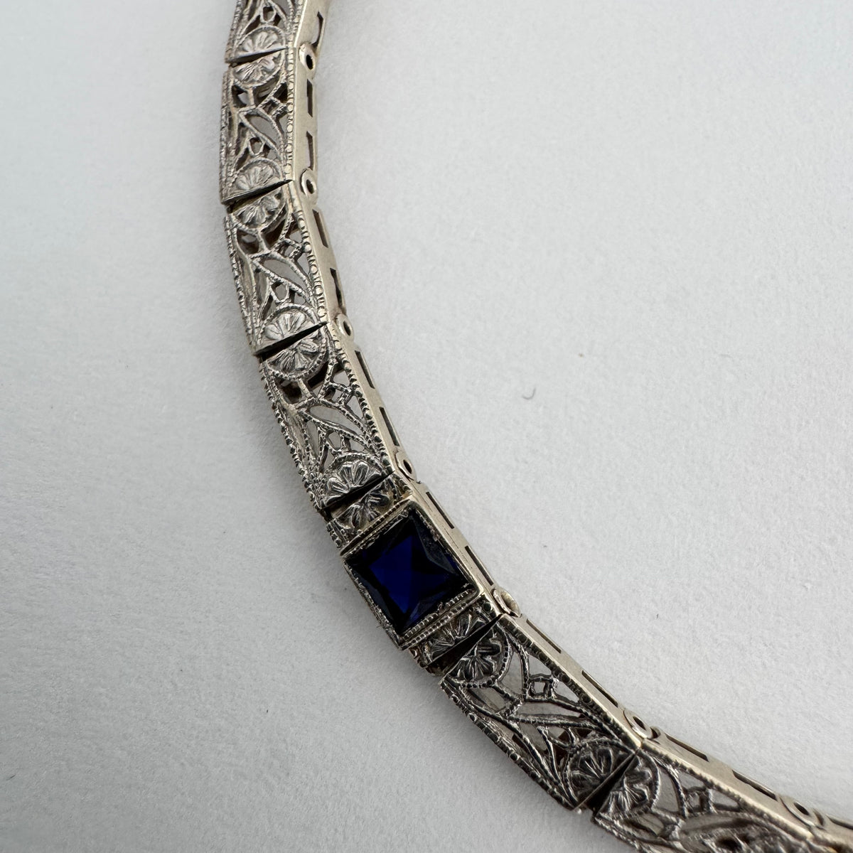 14K gold bracelet featuring intricate openwork and beautifully engraved details set with Sapphire & Diamonds