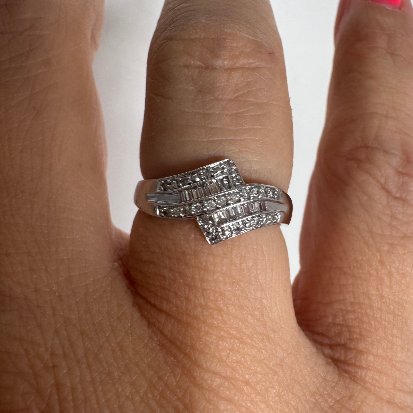 9K gold ring set with natural Diamonds in a unique geometric design.