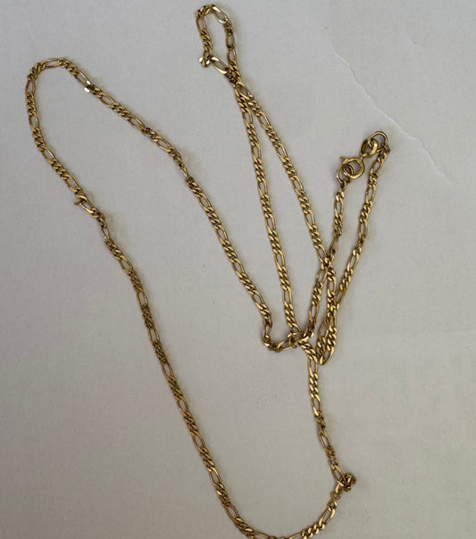 14K gold chain featuring slim, elongated twisted links that create a clean and elegant look