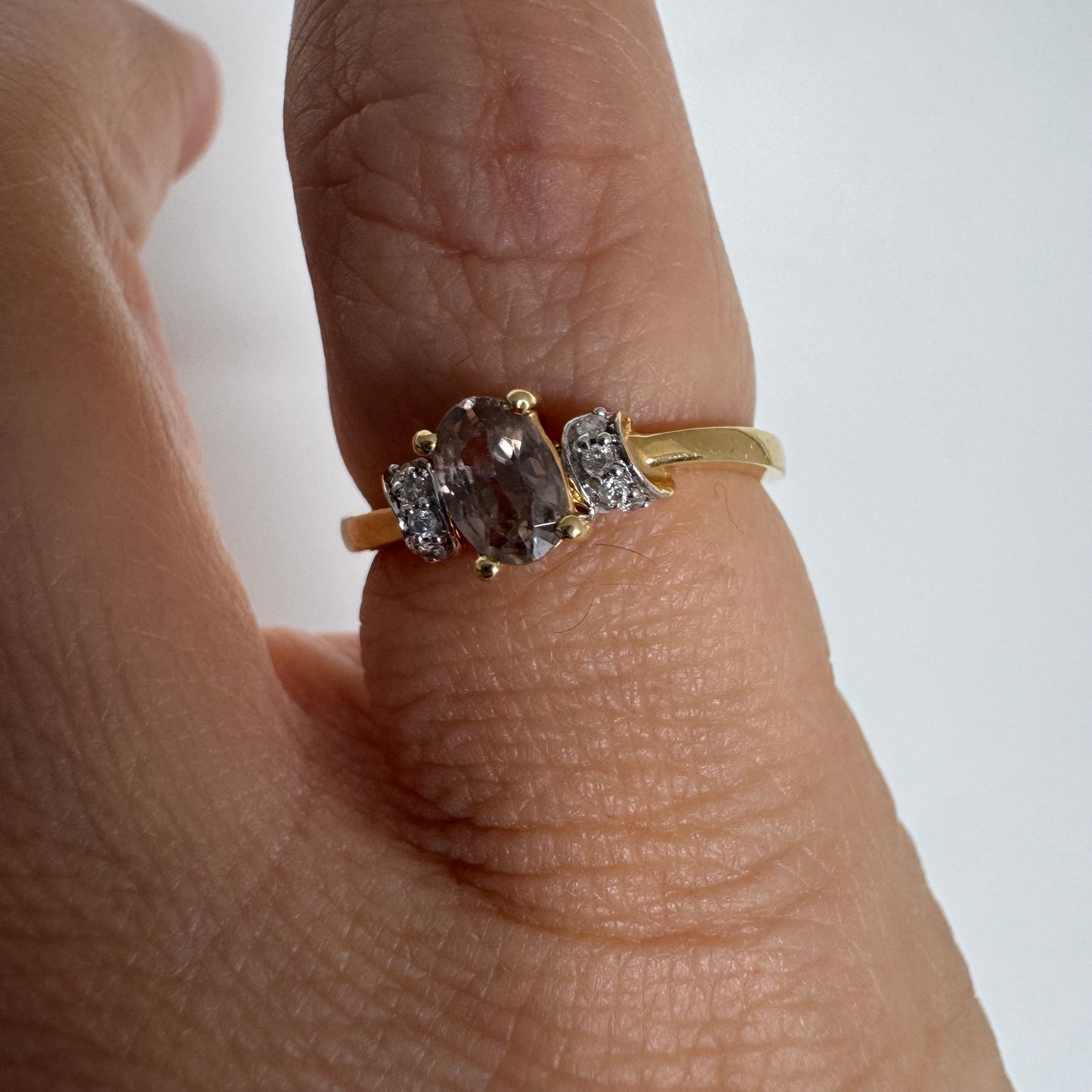 18K gold ring featuring a captivating oval Smoky Quartz & side Diamonds