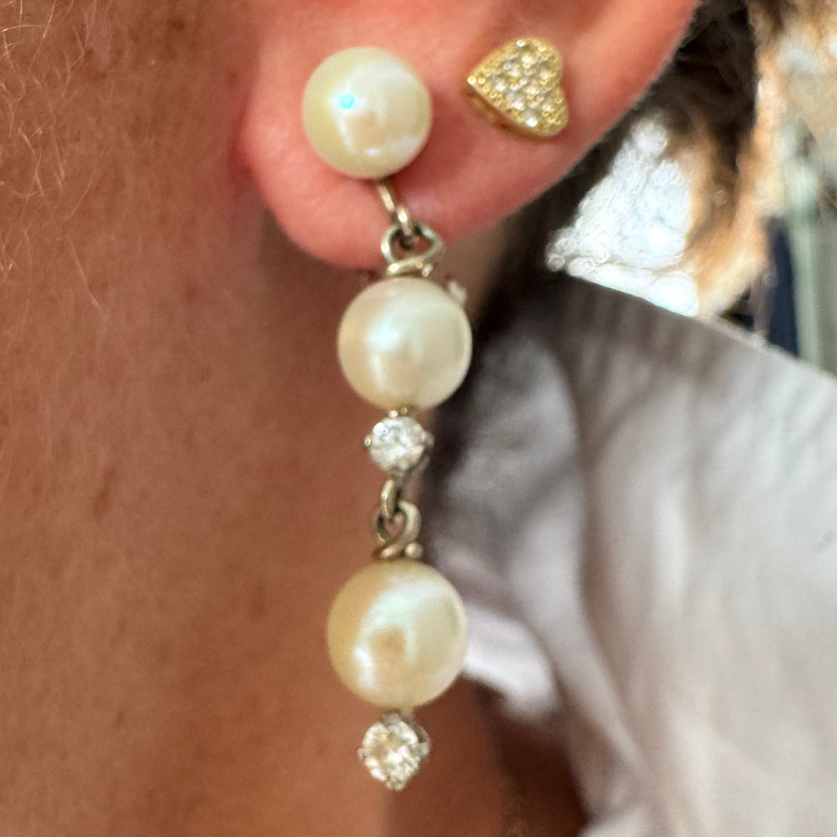 14K gold elegant drop earring set with three soft creamy Pearls connected by round brilliant Diamonds