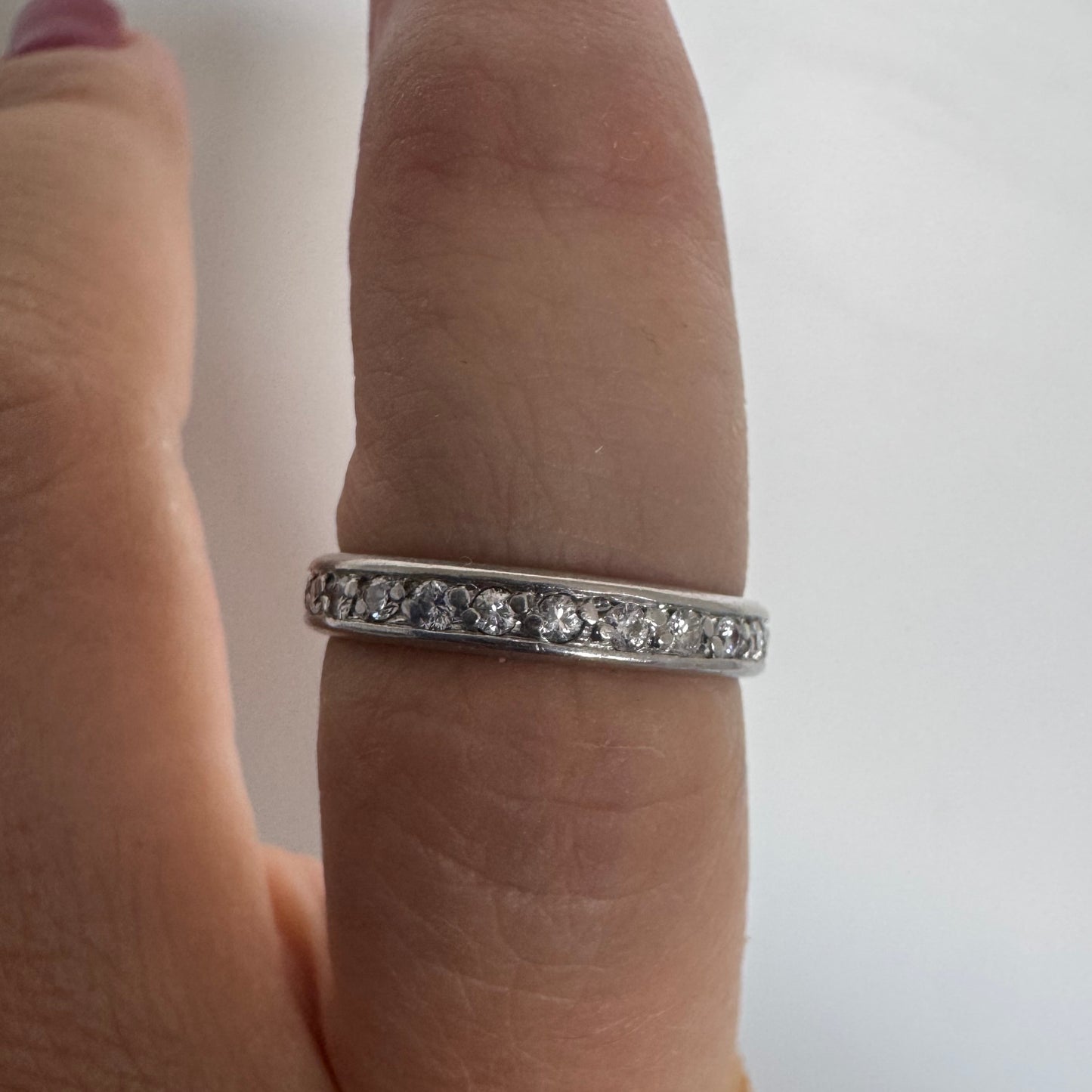 14K white gold eternity ring set with a row of sparkling Diamonds