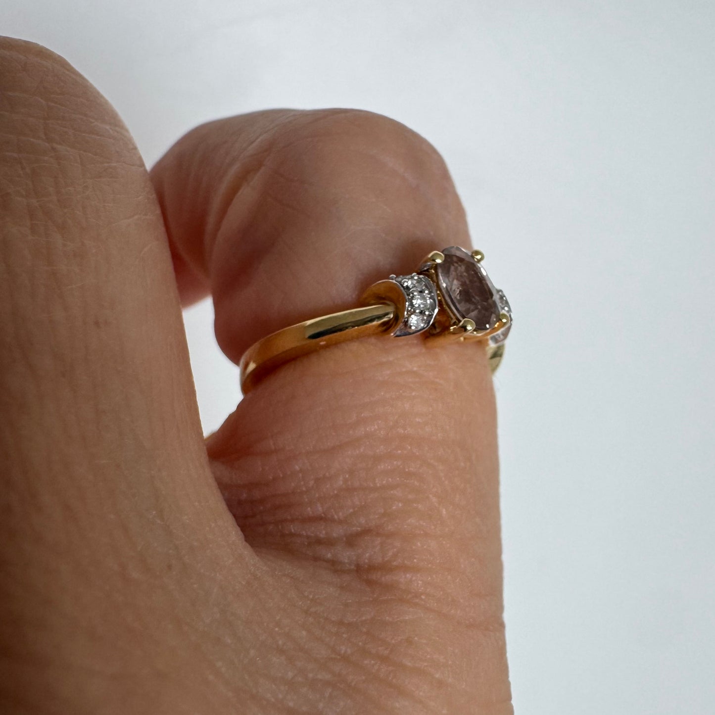 18K gold ring featuring a captivating oval Smoky Quartz & side Diamonds