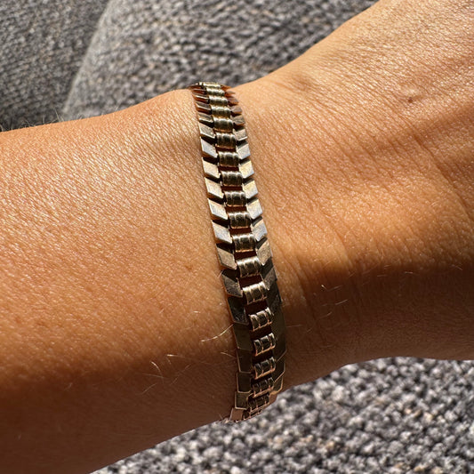 14K gold bracelet with a bold, flexible link design and a secure box clasp.
