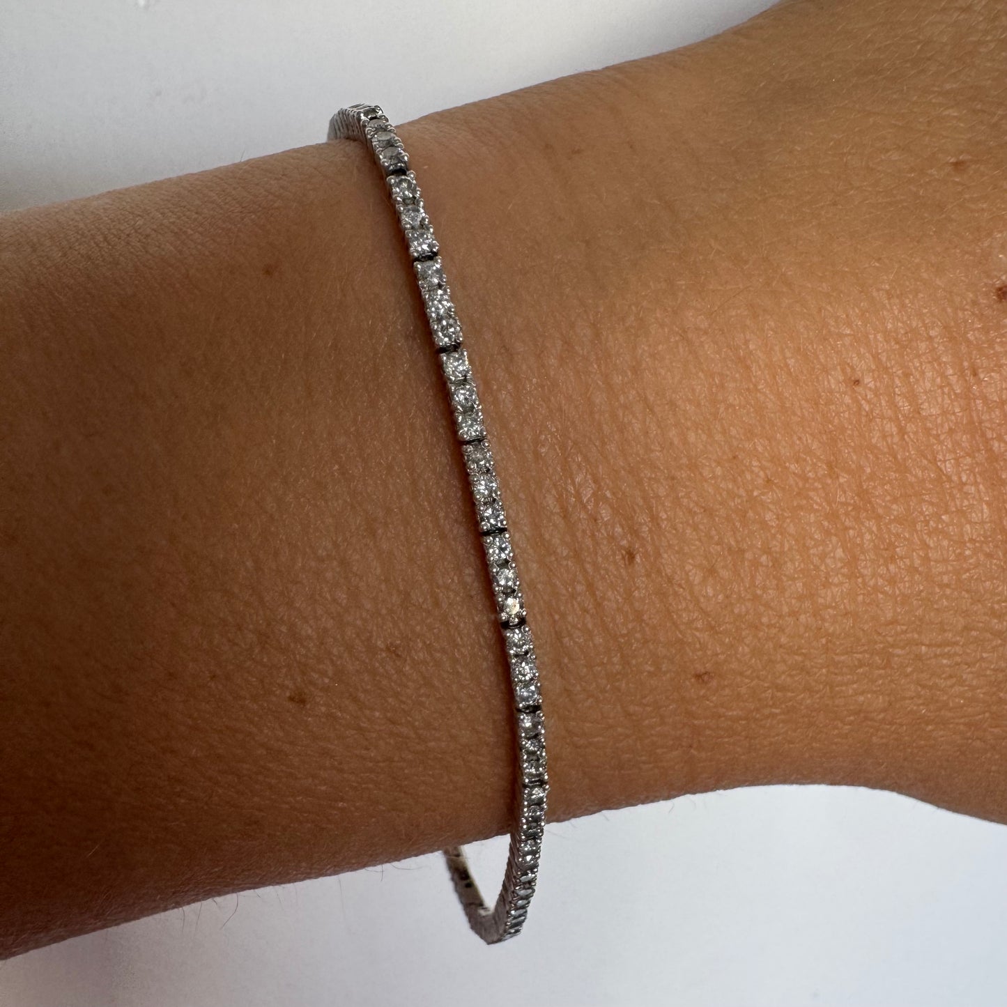 14K gold diamond bracelet with a sleek & elegant design.