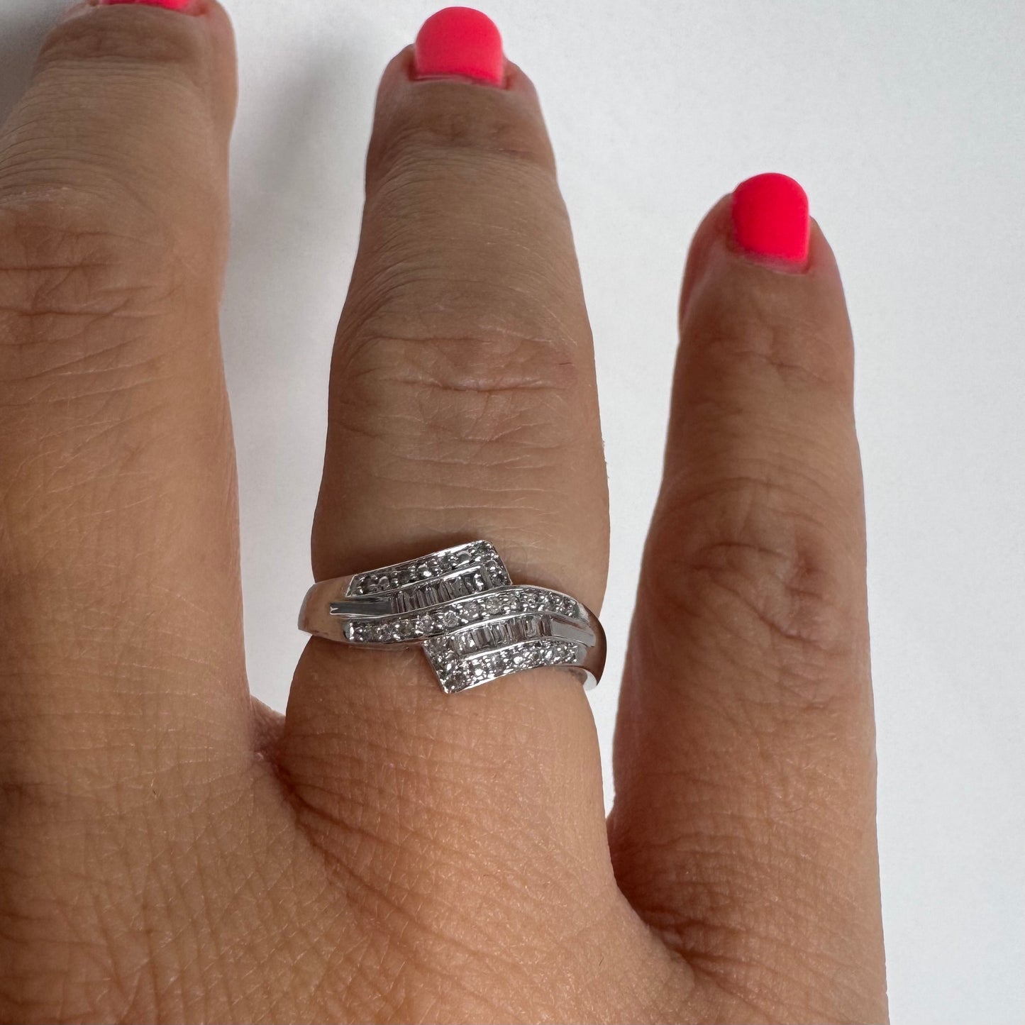 9K gold ring set with natural Diamonds in a unique geometric design.