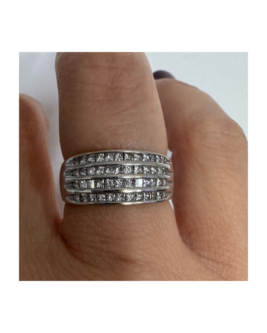 14K gold ring set with four parallel rows of princess-cut Diamonds.
