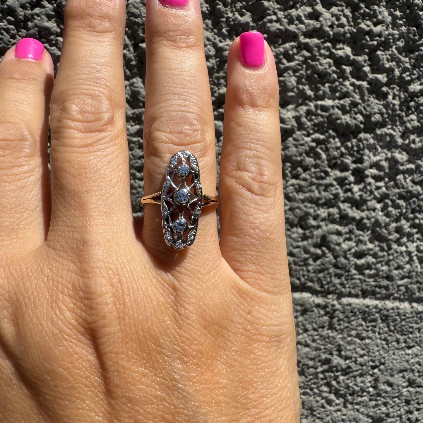 14K gold ring set with diamonds in an elongated openwork design