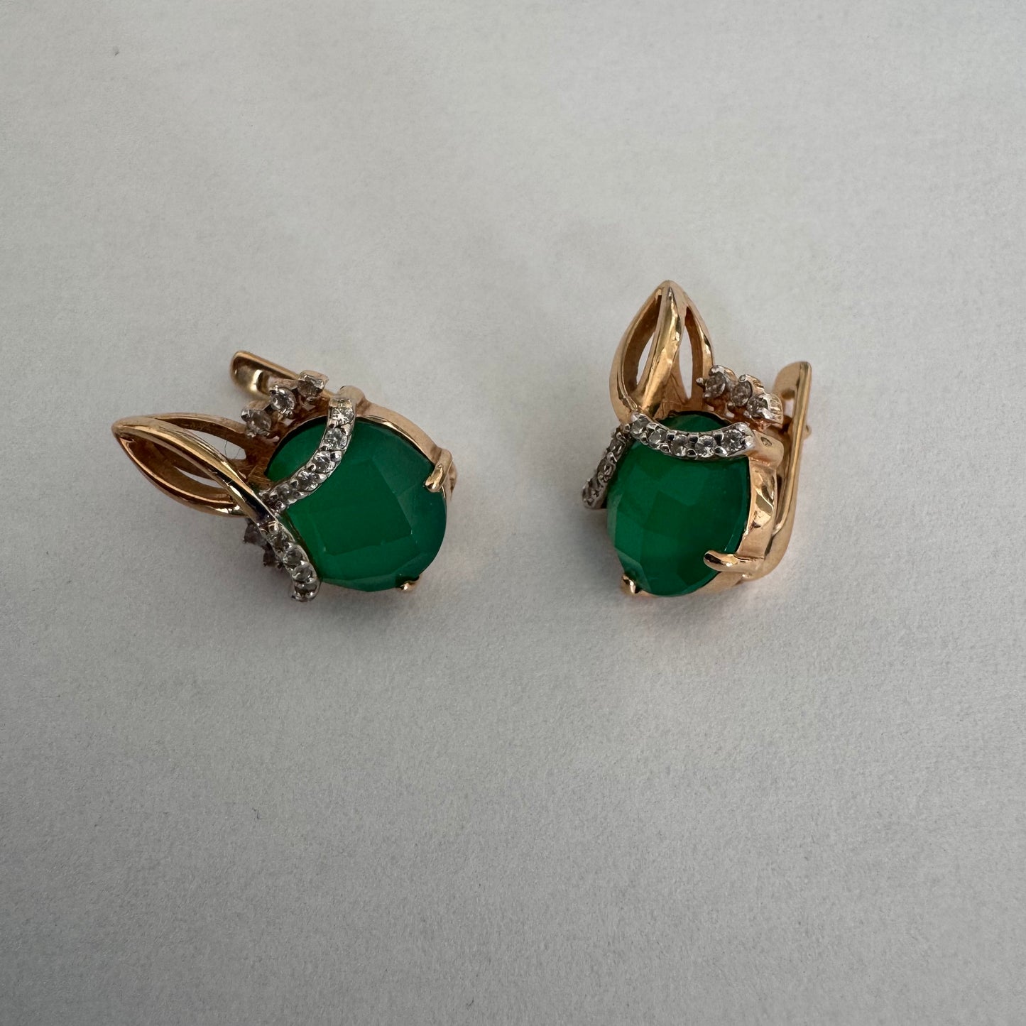 14K gold earrings set with vibrant green stones