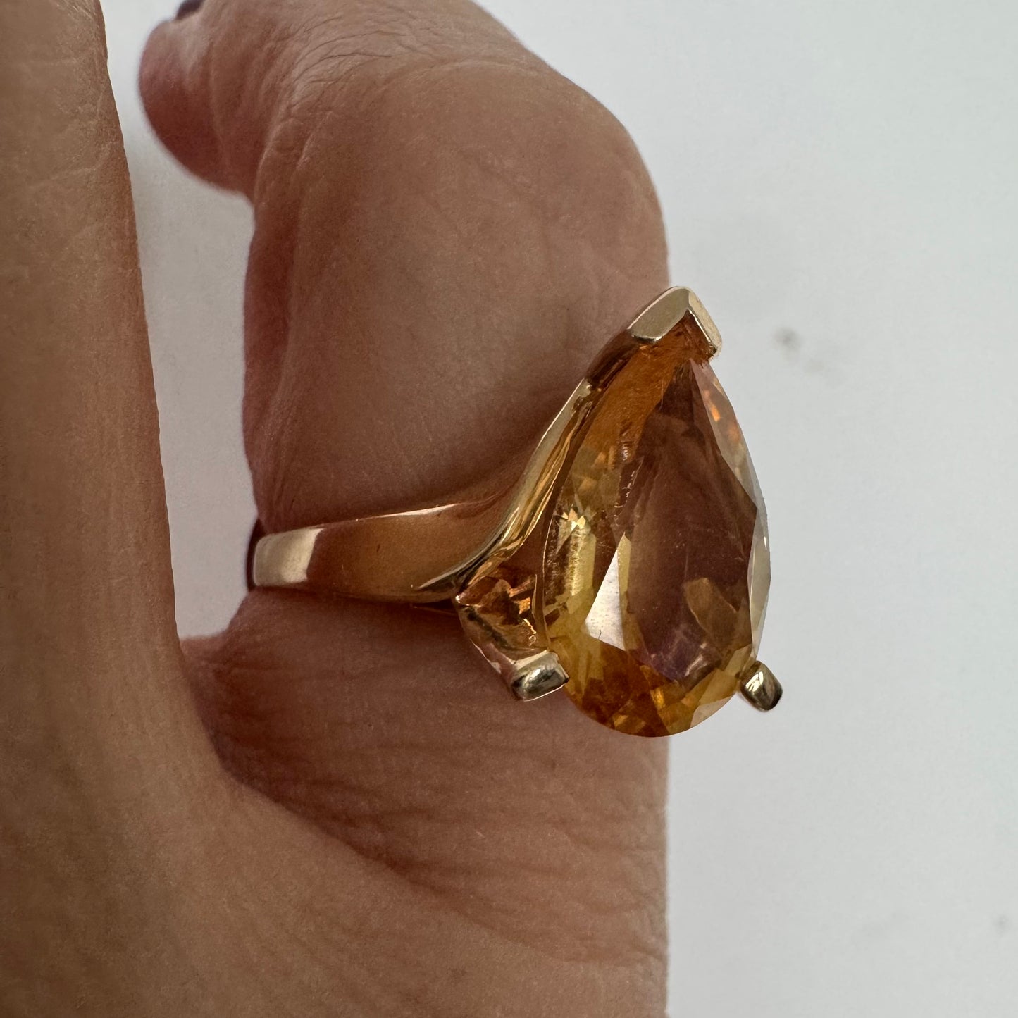 14K gold ring set with a large pear-shaped Citrine