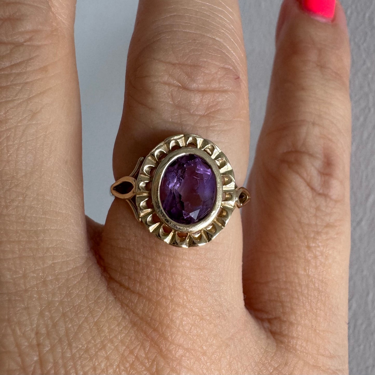 9K gold ring set with a mesmerizing deep purple Amethyst, framed by delicate details that give it a romantic and regal feel.