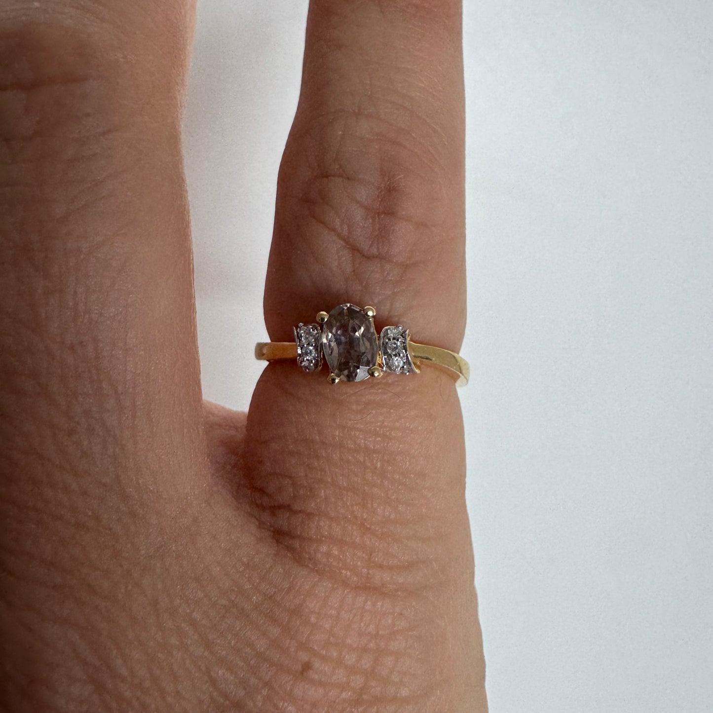 18K gold ring featuring a captivating oval Smoky Quartz & side Diamonds