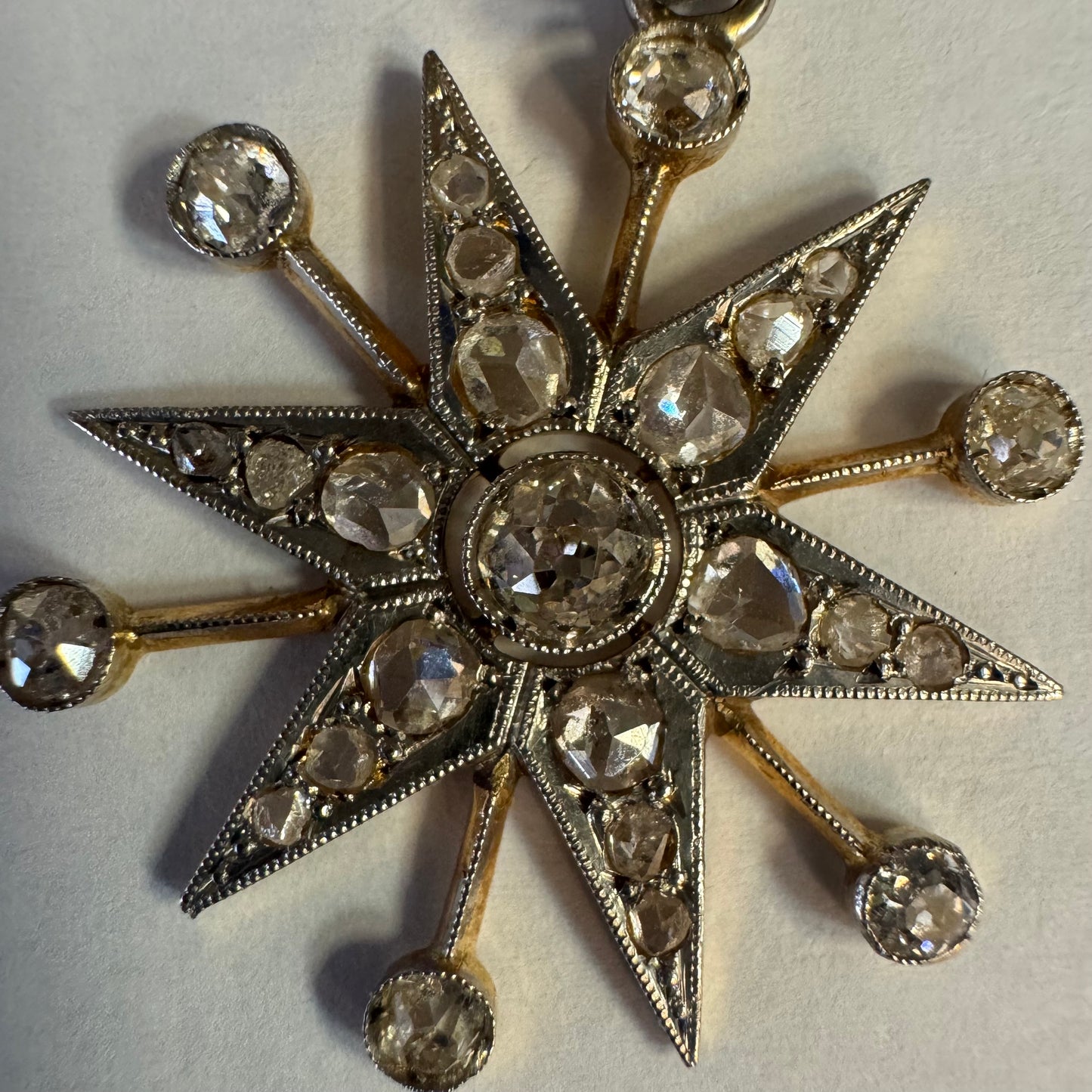 14K gold starburst pendant set with old- cut Diamonds