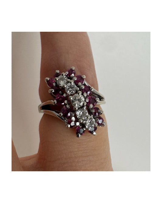 14K gold ring set with a rich cluster of deep raspberry-toned Rubies, centered by a vertical row of sparkling white Diamonds.
