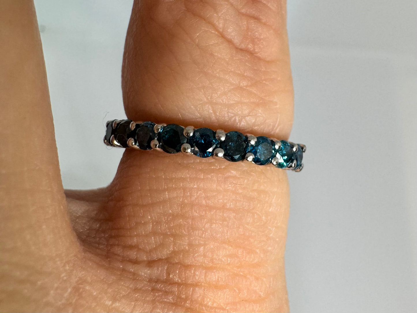 14K gold ring set with Blue Diamonds