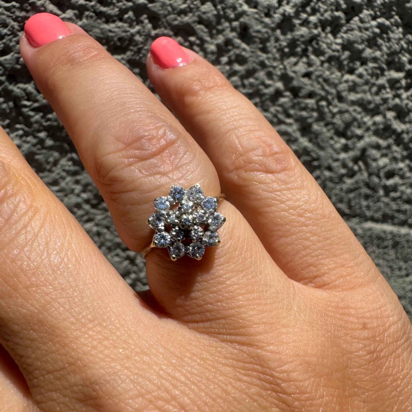 14K gold floral ring set with a dazzling double halo of sparkling Diamonds arranged in a blooming design