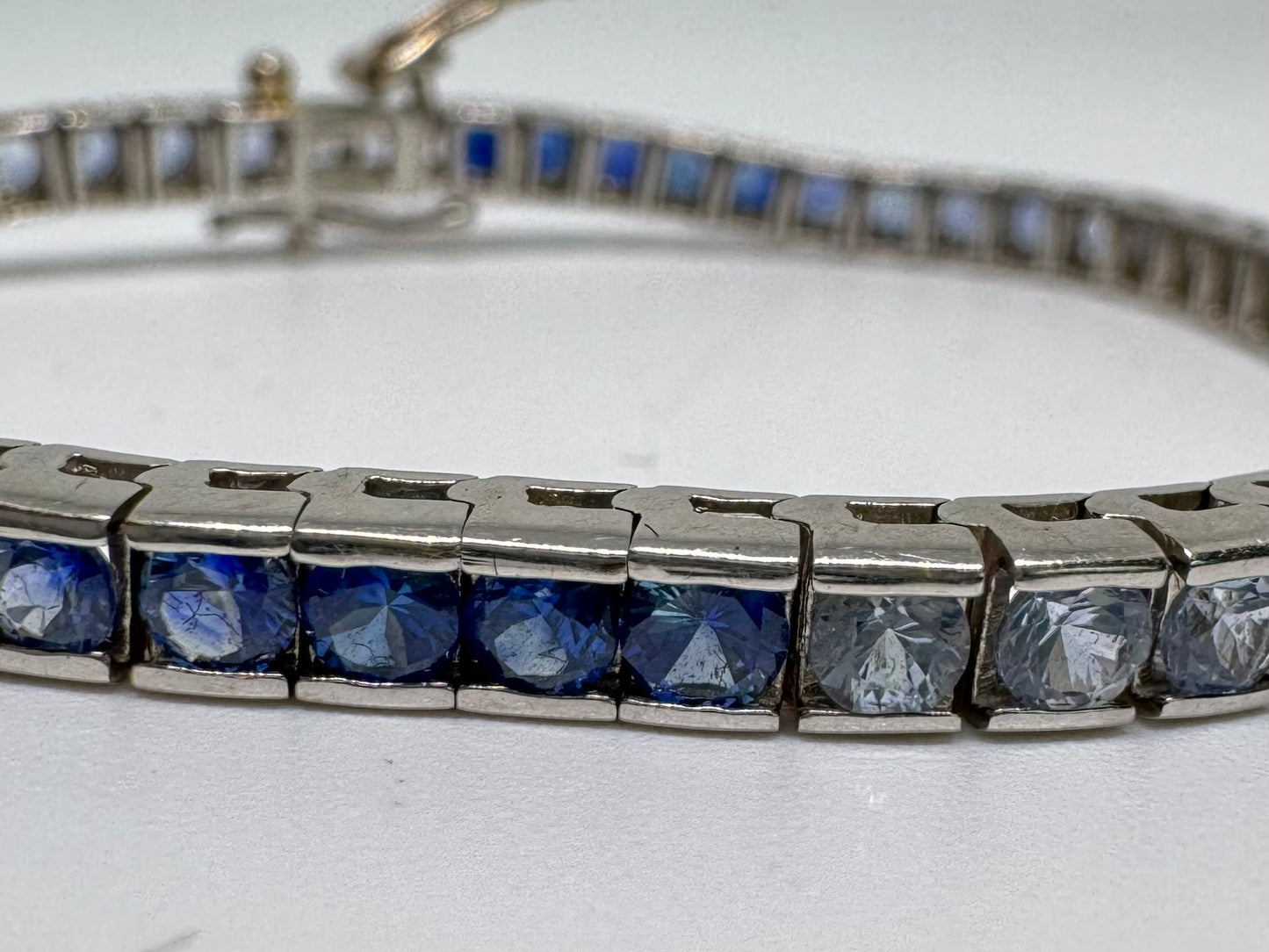 14K gold Tennis Bracelet set with different shades of Sapphire