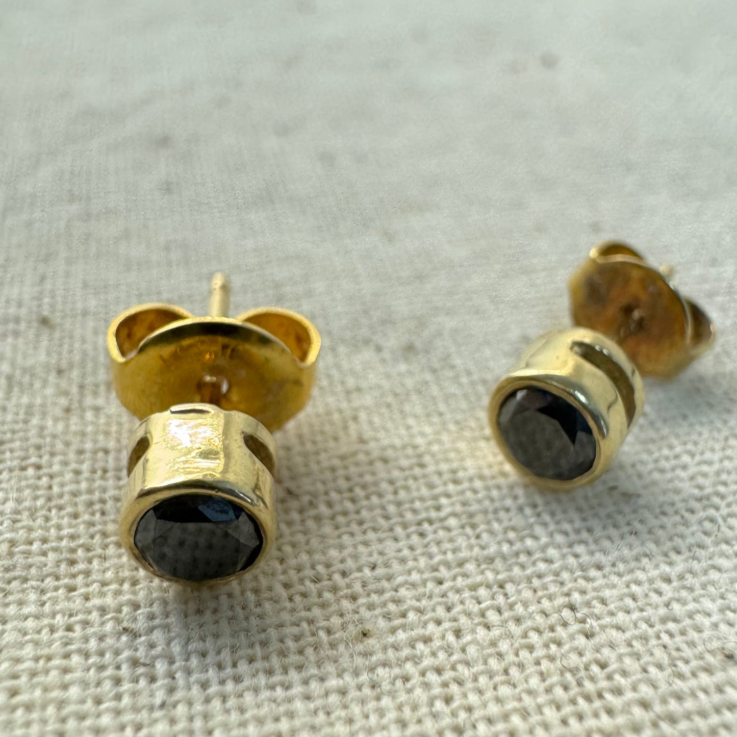 14K gold stud earrings set with Black Diamonds