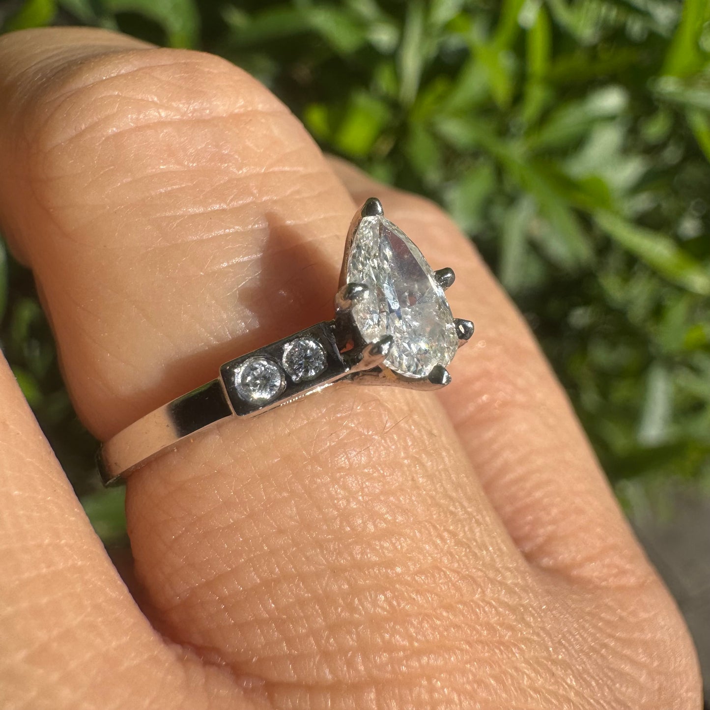 Platinum ring set with one center Pear cut Diamond & side Diamonds