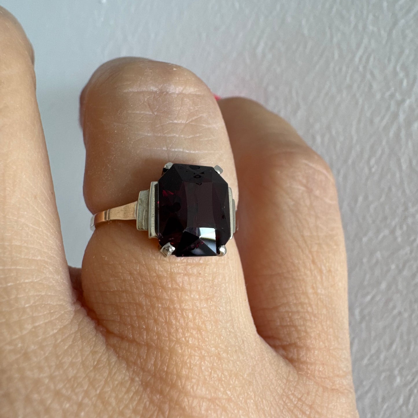 9K gold ring set with a deep burgundy Garnet in an elegant square cut.