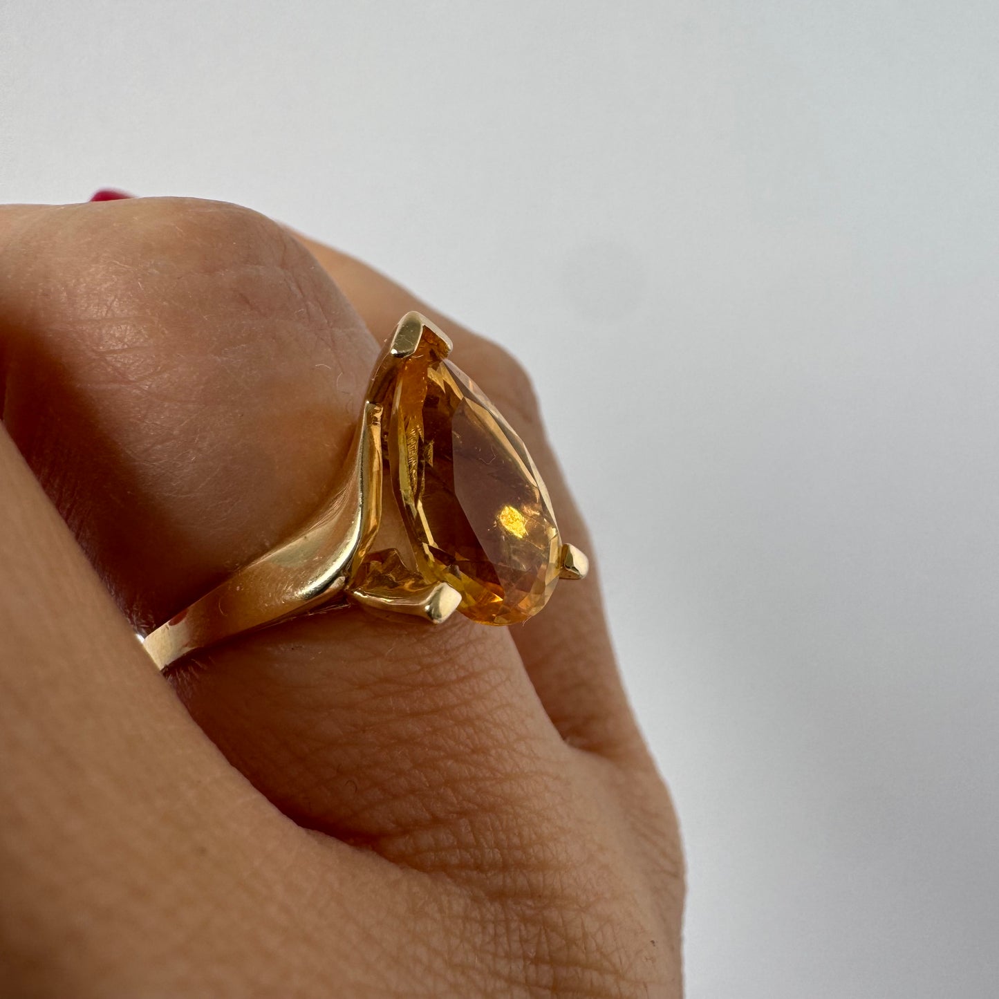 14K gold ring set with a large pear-shaped Citrine