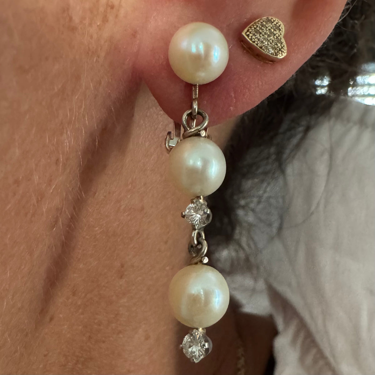 14K gold elegant drop earring set with three soft creamy Pearls connected by round brilliant Diamonds