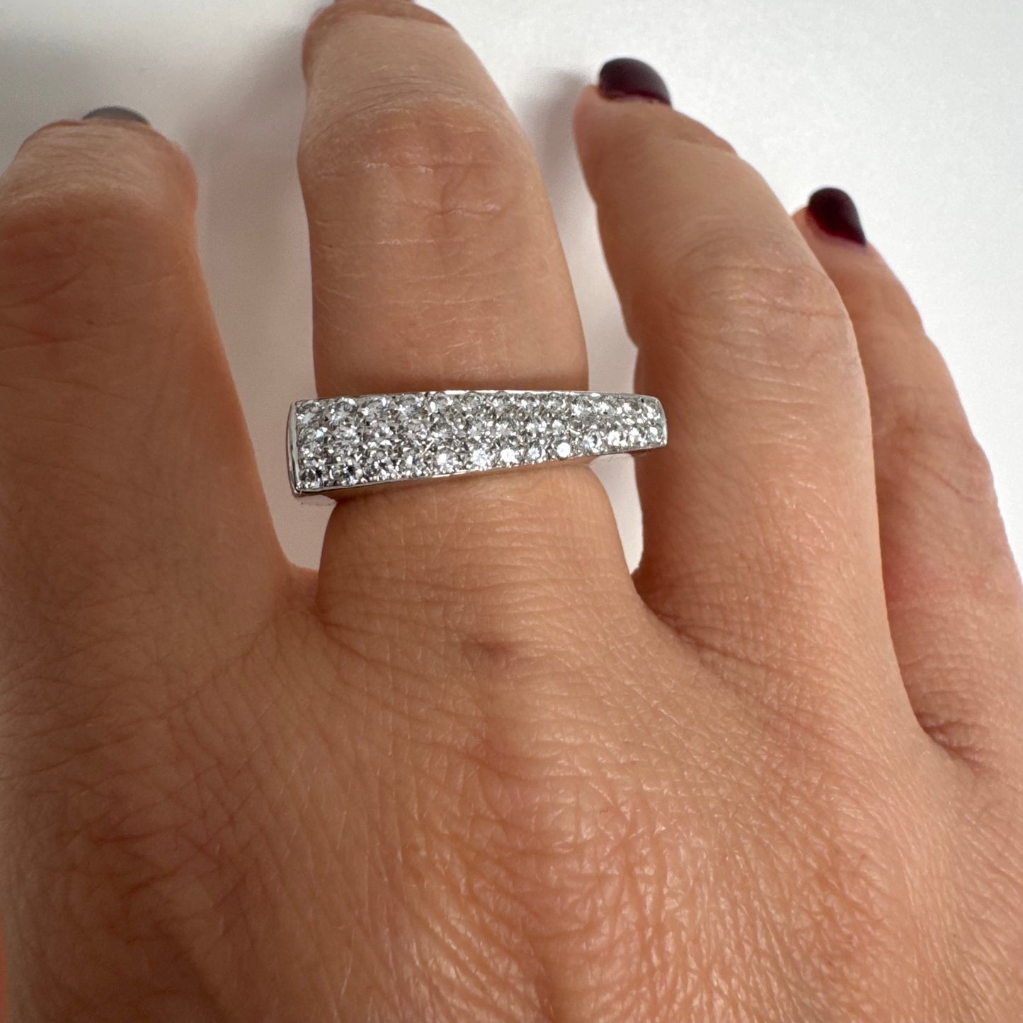 18K white gold band fully set with pavé diamonds across the surface.