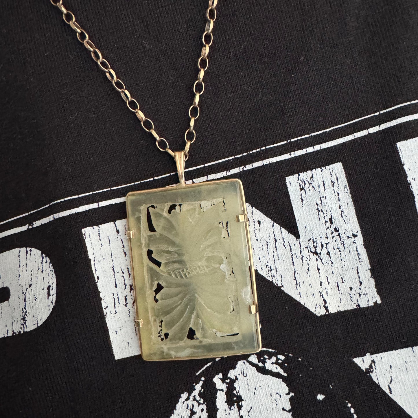 14K gold rectangular pendant set with a hand-carved milky Jade stone