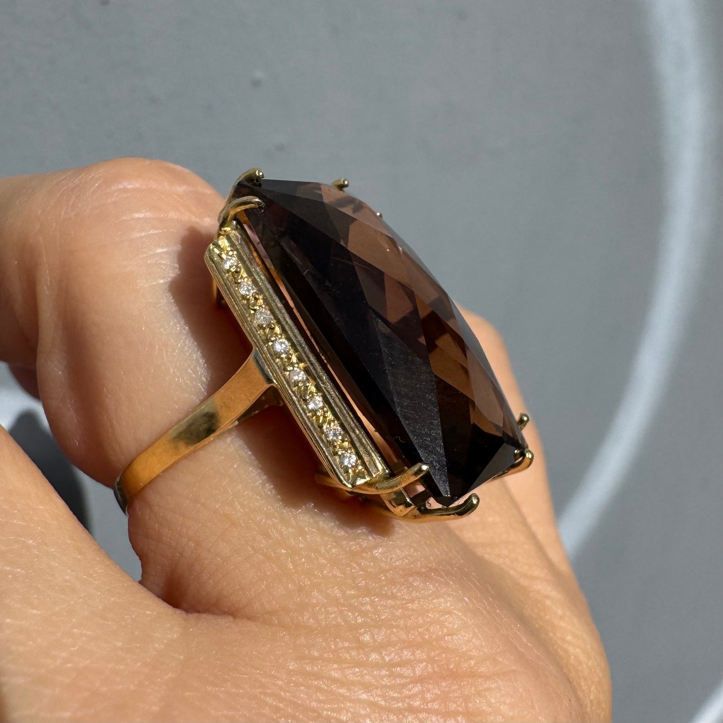 18K gold statement ring set with an oversized rectangular faceted Smoky Quartz center stone & Diamonds