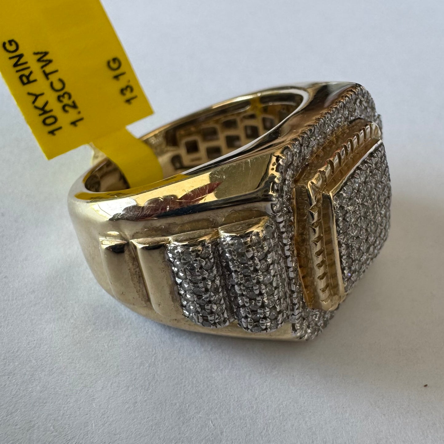 10K gold ring set with sparkling Diamonds in a bold geometric design.