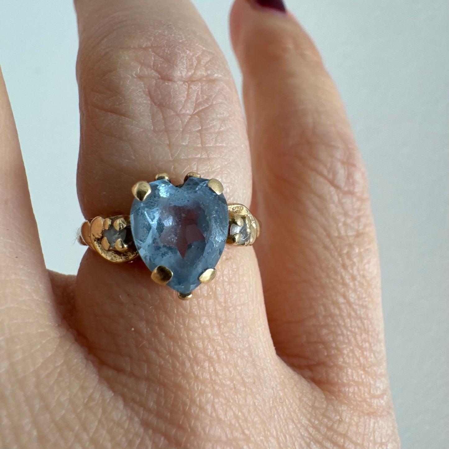 14K gold ring set with a heart-cut Blue Topaz stone