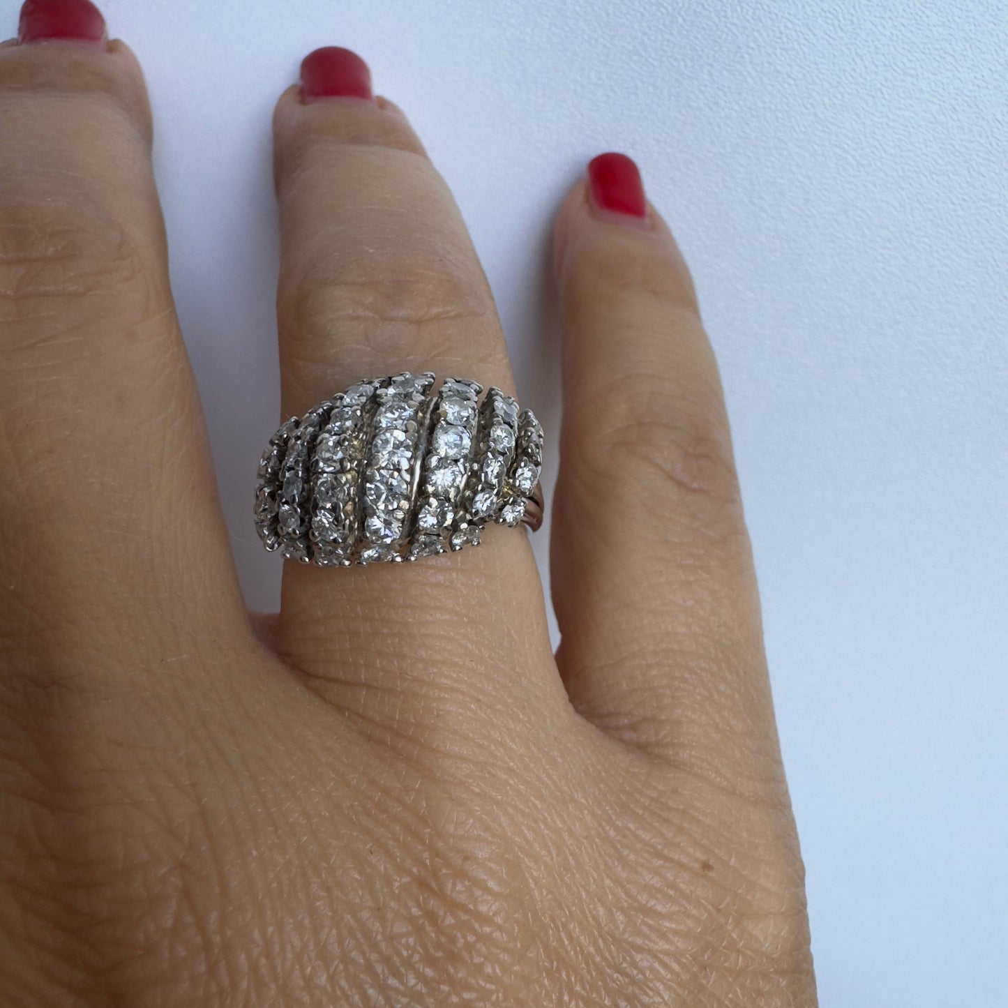 18K gold ring set with rows of sparkling Diamonds in a bold, sculptural design