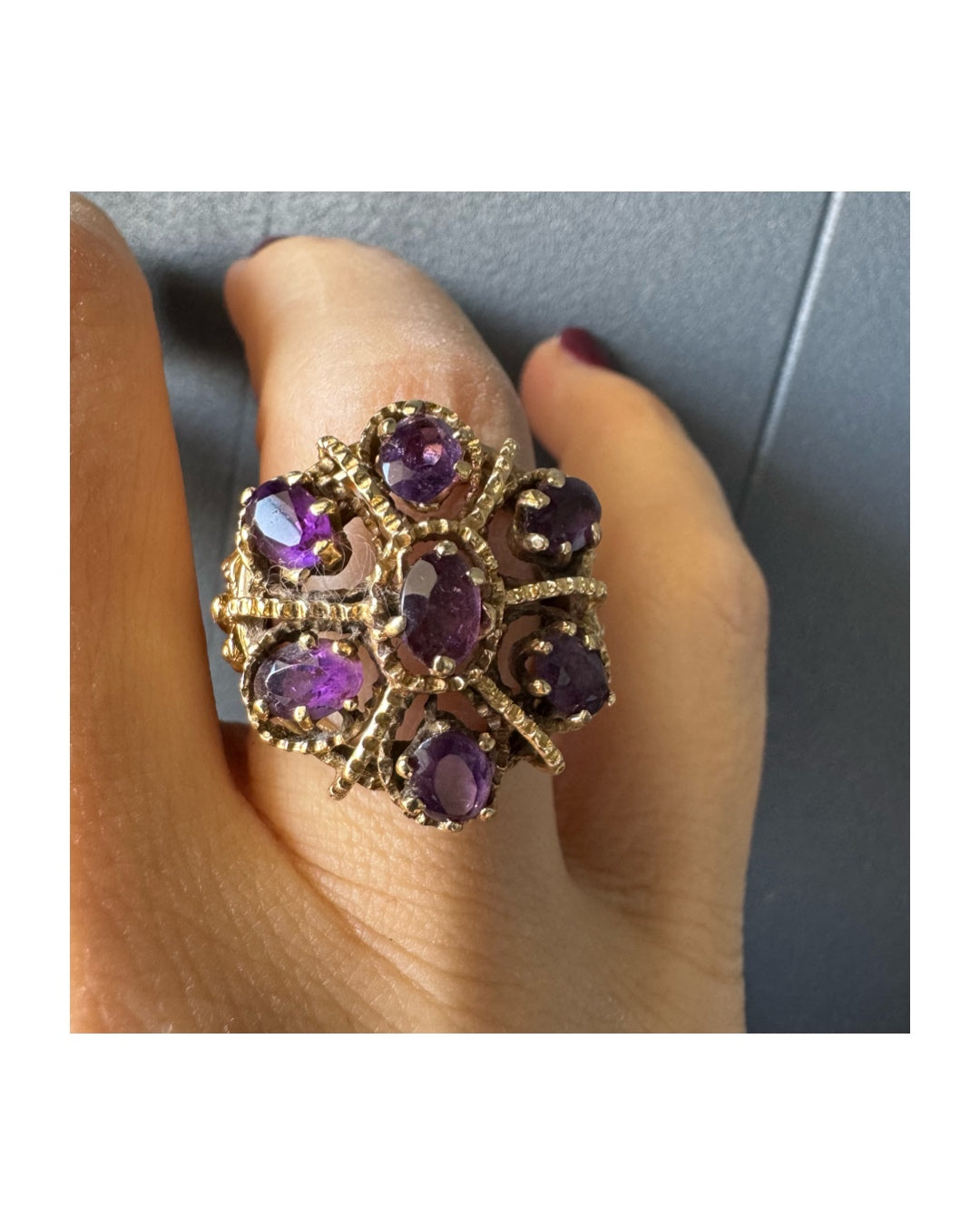 14K yellow gold cocktail ring set with a stunning cluster of Amethyst stones in marquise cuts.