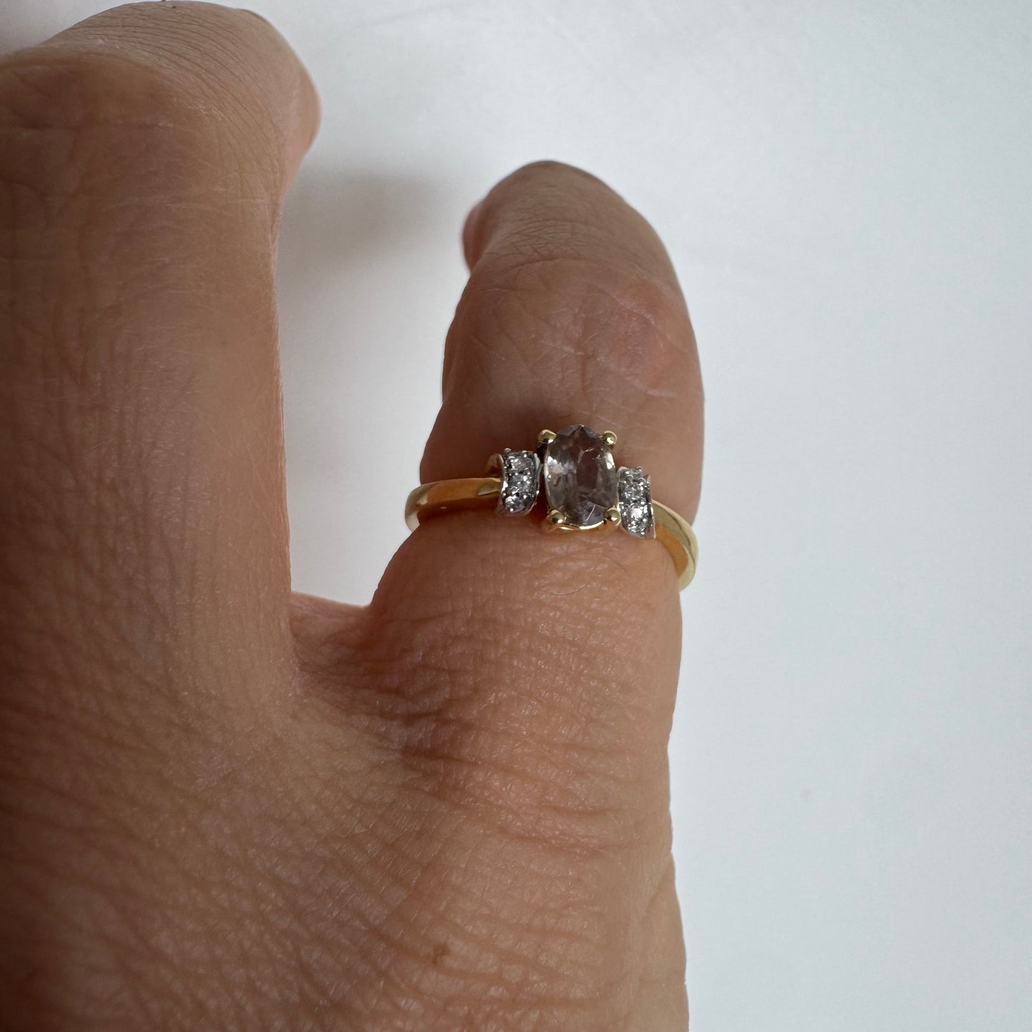 18K gold ring featuring a captivating oval Smoky Quartz & side Diamonds